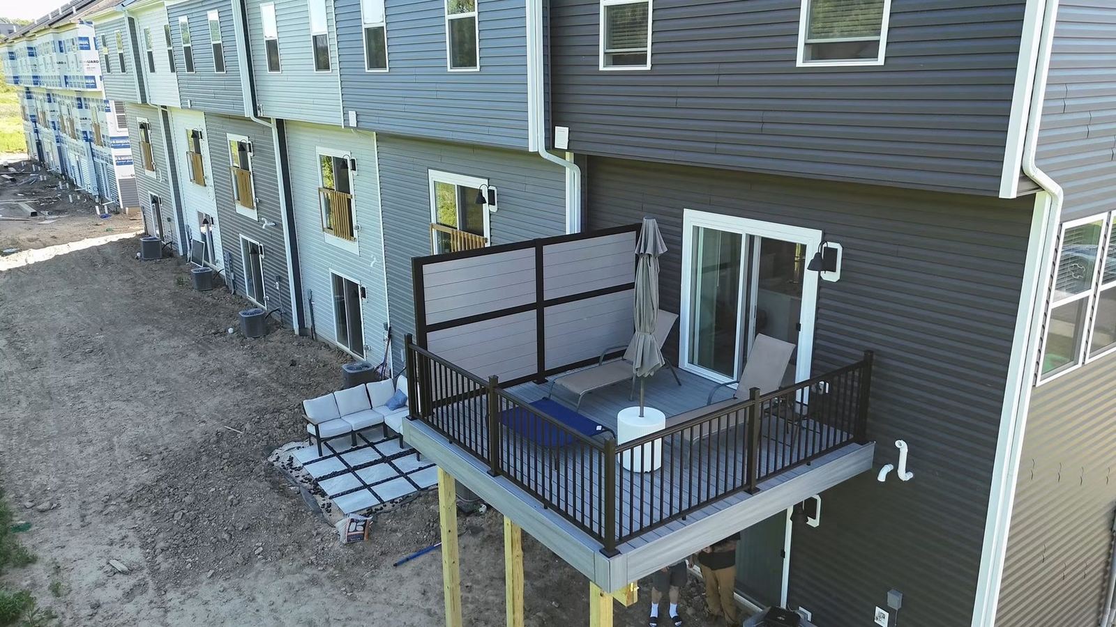 Trex deck with RDI privacy rail panel in a Harmony Jackson Township townhome development