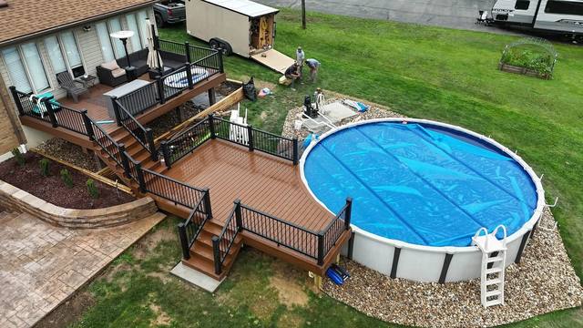 Multi-level Trex Saddle deck overlooking an above-ground pool in Ellwood City PA