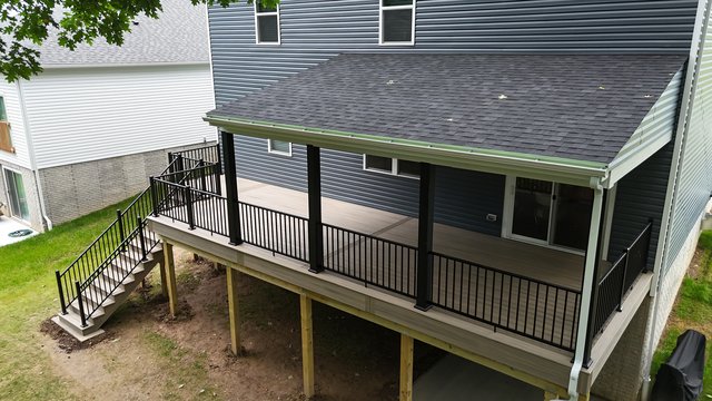 Covered Trex deck with a built roof, siding, and Key-Link aluminum post wraps, Evans City PA