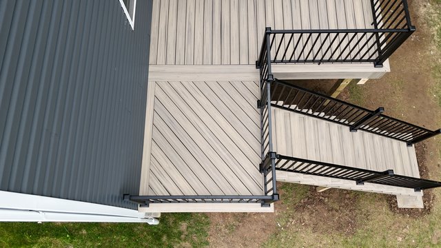 Custom diagonal Trex stair landing with gate, Evans City PA