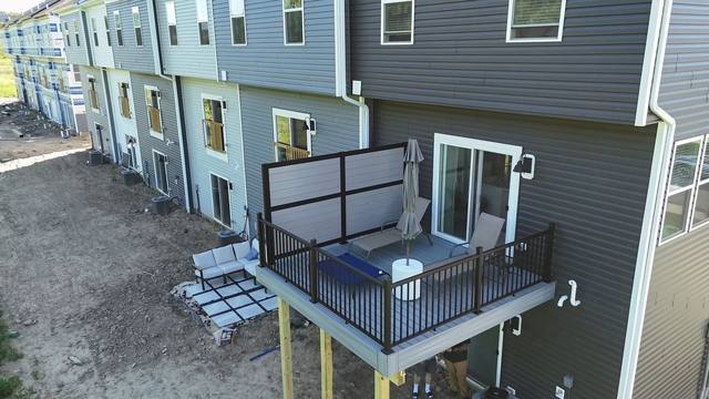 Trex deck with RDI privacy rail panel in a Harmony Jackson Township townhome development