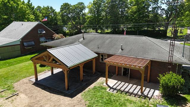 Timber frame pavilion in Larch wood with standing seam metal roof, Mercer PA