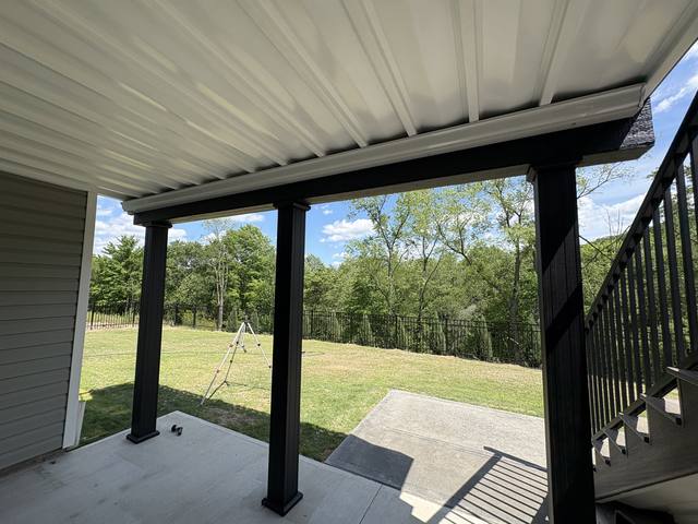 TimberTech AZEK under-deck waterproofing system creating a dry usable space below a deck